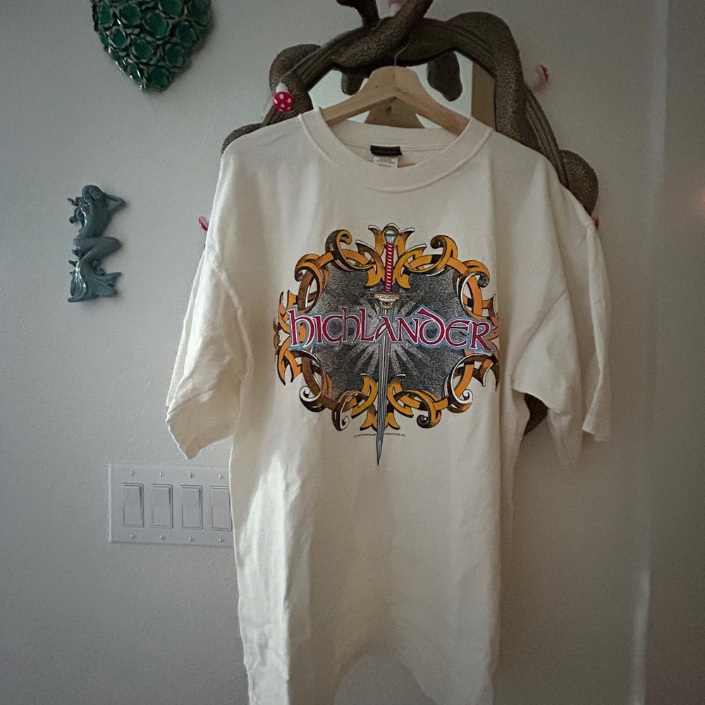 Vintage 90s Highlander Graphic Crewneck Tee in Cream with Yellow & Red Accents